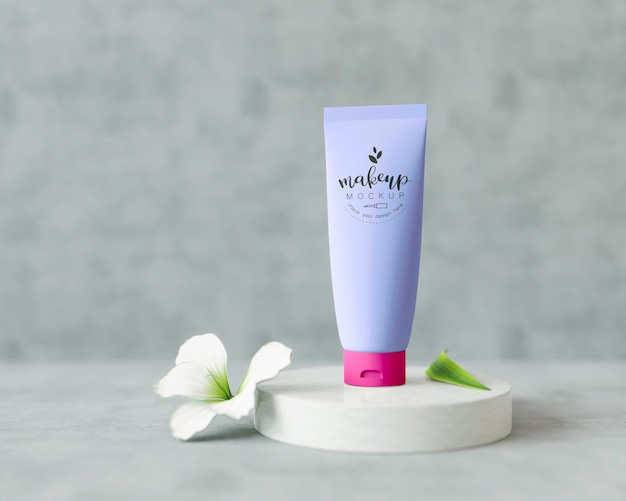 Cosmetic product on a stand with flowers