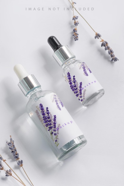 PSD cosmetics bottle mockup with pipets and lavender flowers