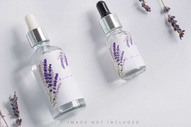 PSD cosmetics bottle mockup with pipets and lavender flowers