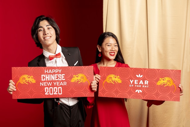 Couple holding decoration for new year