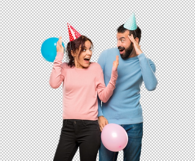 PSD couple with balloons and birthday hats with surprise and shocked facial expression