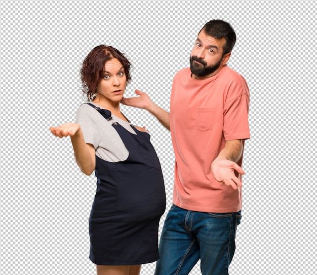 PSD couple with pregnant woman making doubts gesture while lifting shoulders