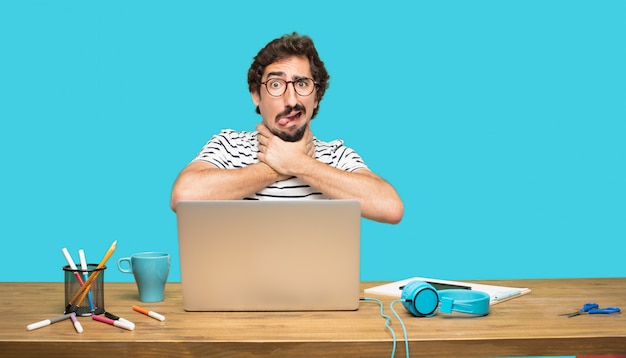 PSD crazy man with laptop with fearful expression