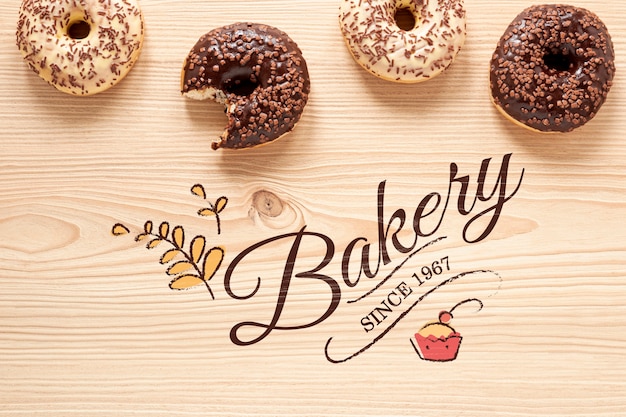 Delicious donuts on wooden table mock-up