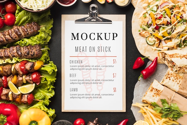 Delicious meat skewers mock-up and clipboard