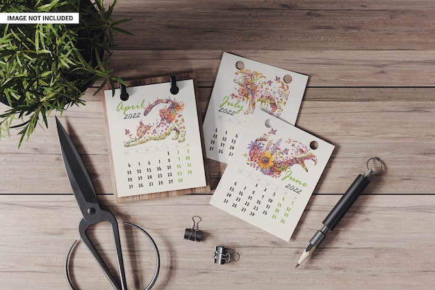 Desk calendar on a wooden base with separate sheets mockup