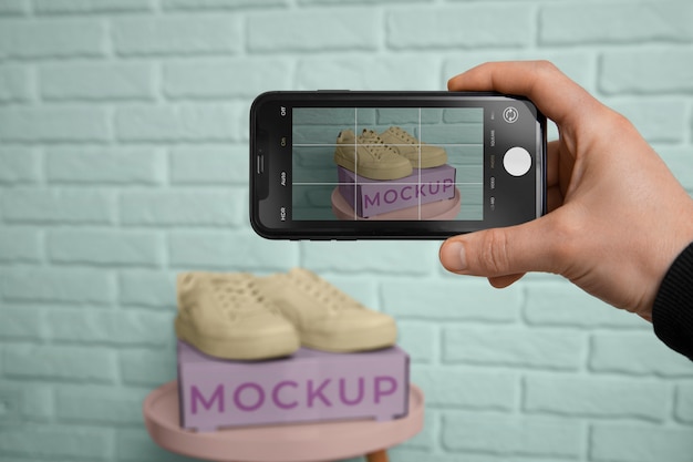 Device taking picture of shoes mockup