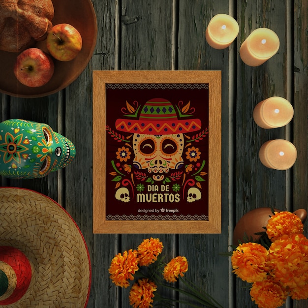 Dia de muertos skulls with sombrero on wooden background top view