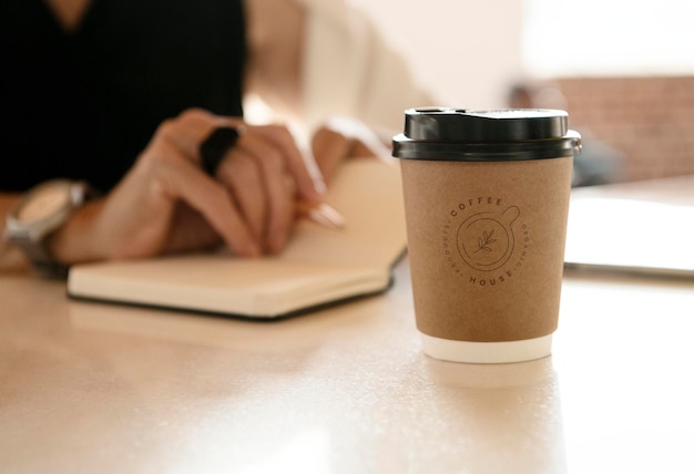 A disposable coffee cup on the table