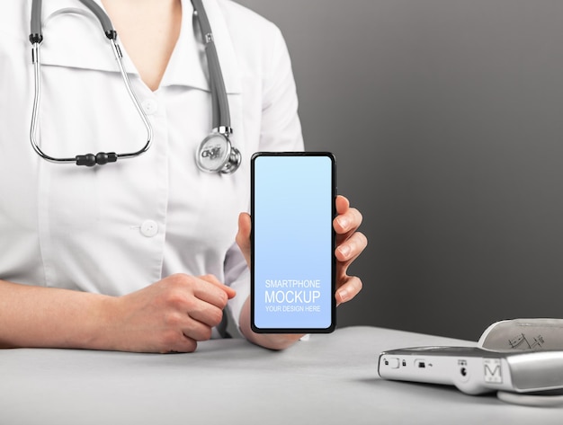 Doctor hand holding mobile phone screen in hand Medical smartphone mockup