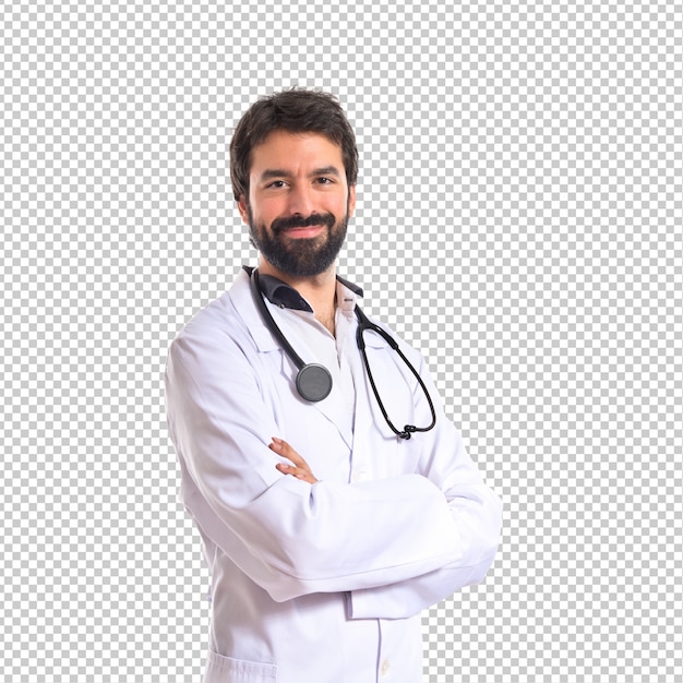 Doctor with his arms crossed over white background