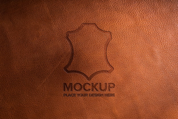 Dramatic warm light over leather logo mockup