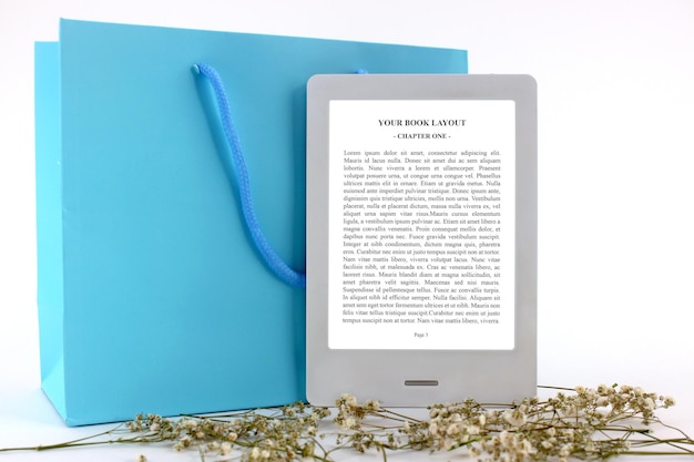 PSD ebook reader mockup with blue gift bag and flowers