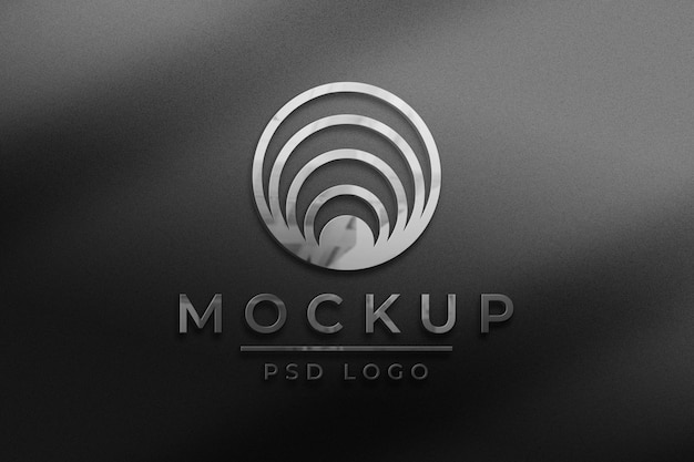 Editable metallic business logo mockup psd in embossed style