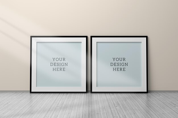 Editable psd mockup with two black square blank frames standing on wooden floor next to wall