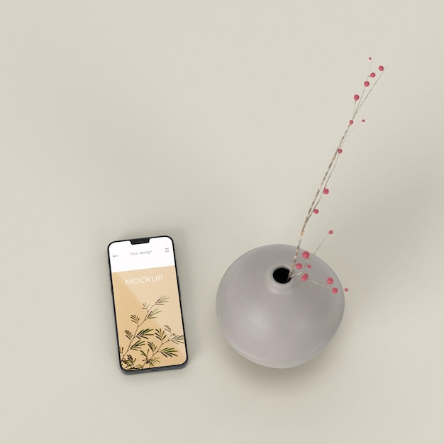 Elegant arrangement with mock-up smartphone and vase