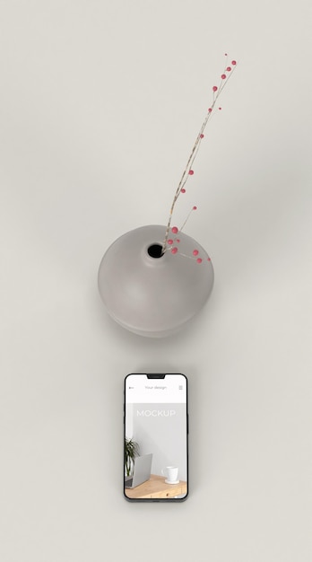 Elegant arrangement with mock-up smartphone and vase