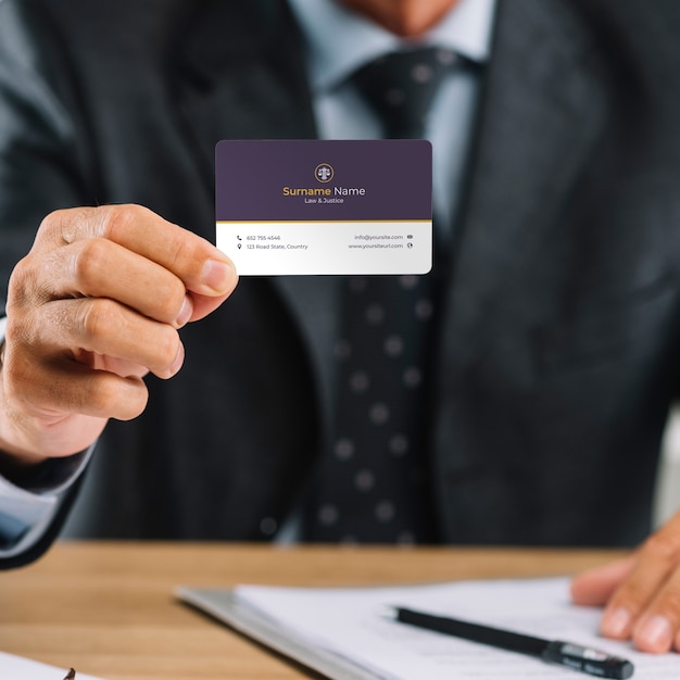 Elegant businessman presenting business card mocku