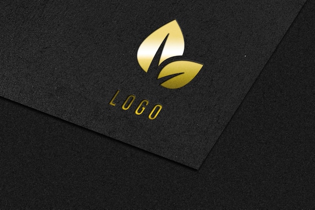 Elegant golden logo mockup on a black paper