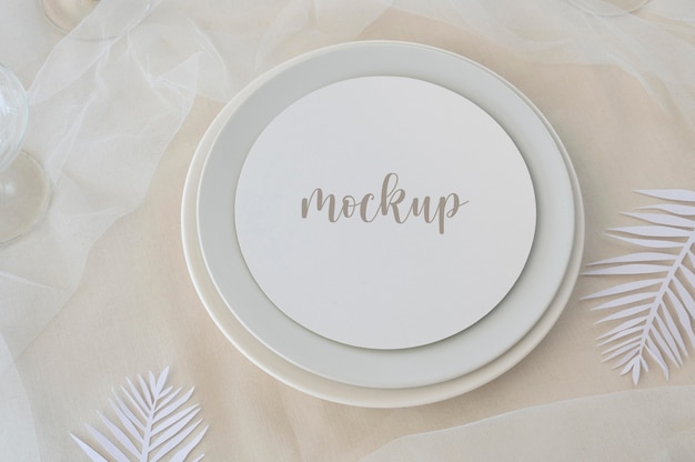 Elegant tableware arrangement with round mock-up card