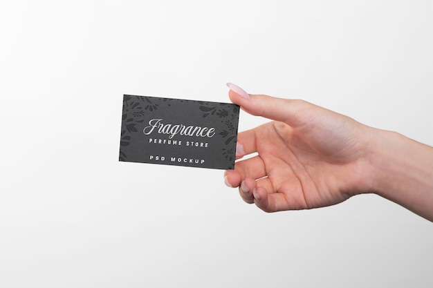 Embossed business card held in hand