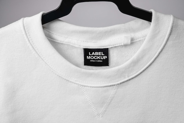 Empty black label on white sweatshirt for logo size and info Blank mockup for your design