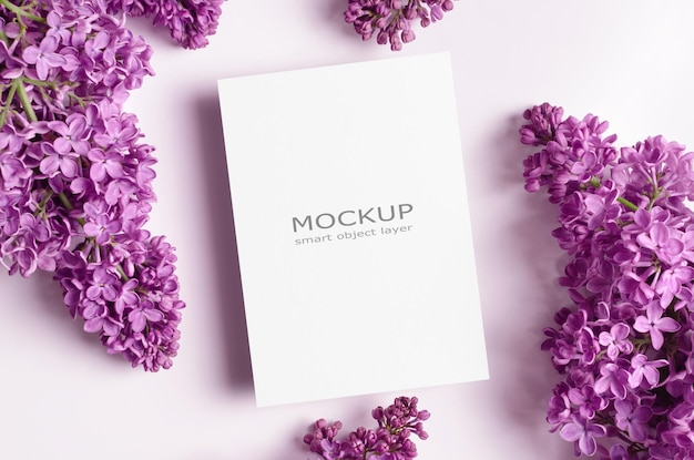 Empty invitation or greeting card mockup with lilac flowers