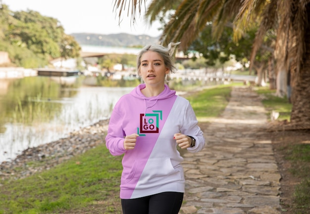 Female wearing hoodie running