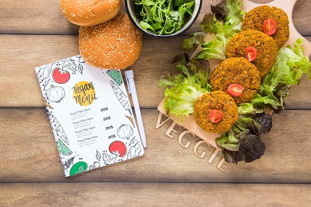 Flat lay arrangement with tasty food on wooden table