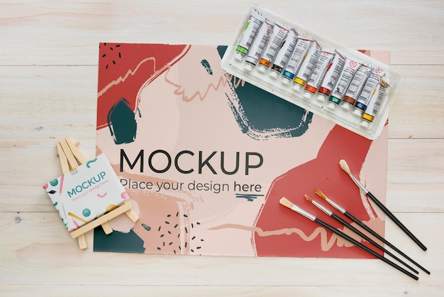 Flat lay artist concept assortment with paper mock-up