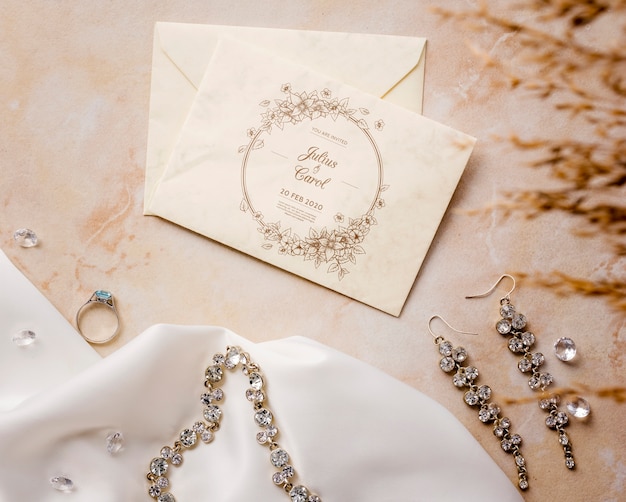 Flat lay beautiful arrangement of wedding elements with card mock-up