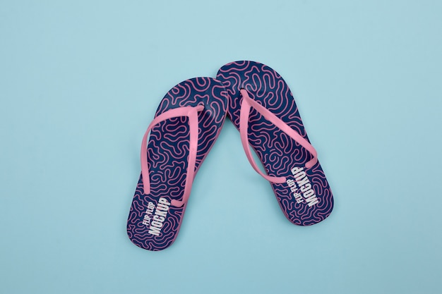 Flat lay blue and pink flip flops in studio