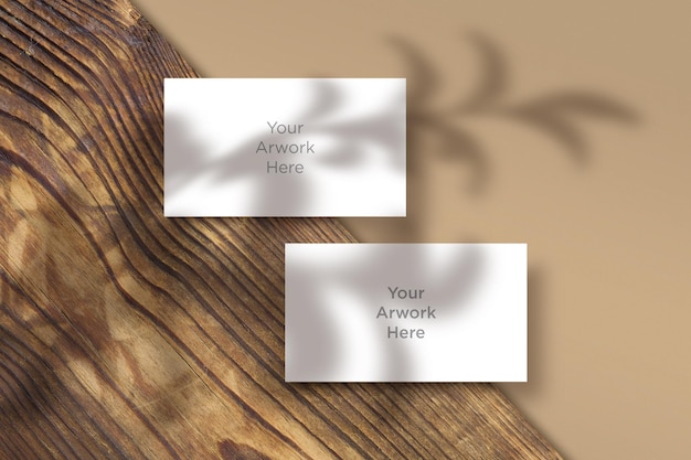 Flat Lay Business Card  Mockup with leaves shadow on wooden Piece