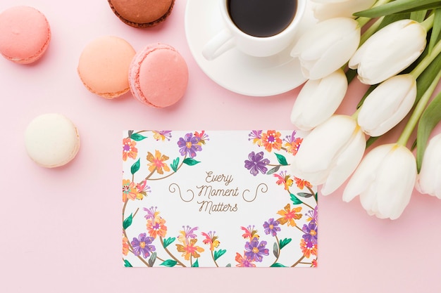 Flat lay of card with macarons and tulips