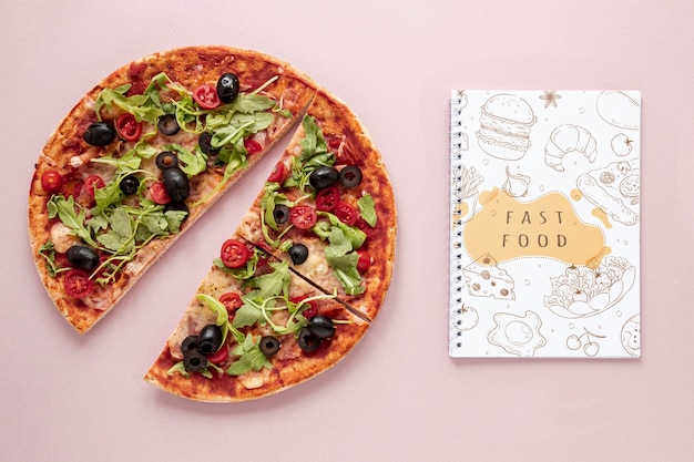 Flat lay of delicious pizza on plain background mock-up