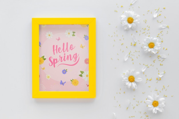 Flat lay frame mockup with spring flowers