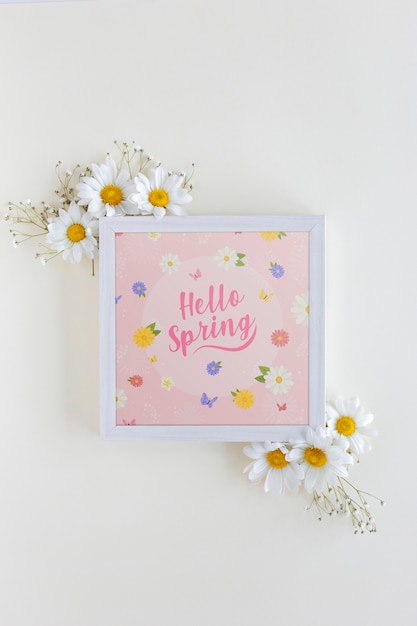 Flat lay frame mockup with spring flowers