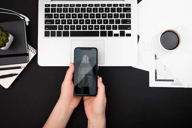 Flat lay of hands holding a smartphone