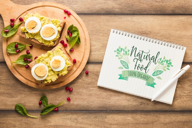 PSD flat lay of healthy food with notepad mockup