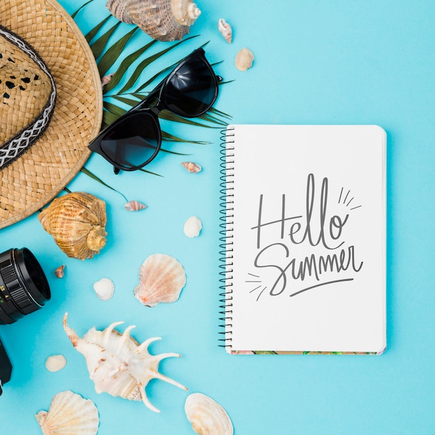 Flat lay notepad mockup with summer elements