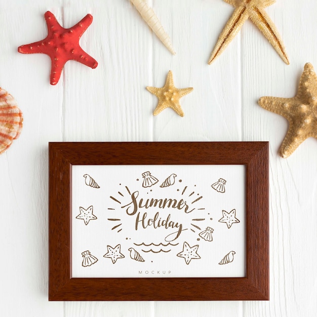 Flat lay photo frame on wooden background