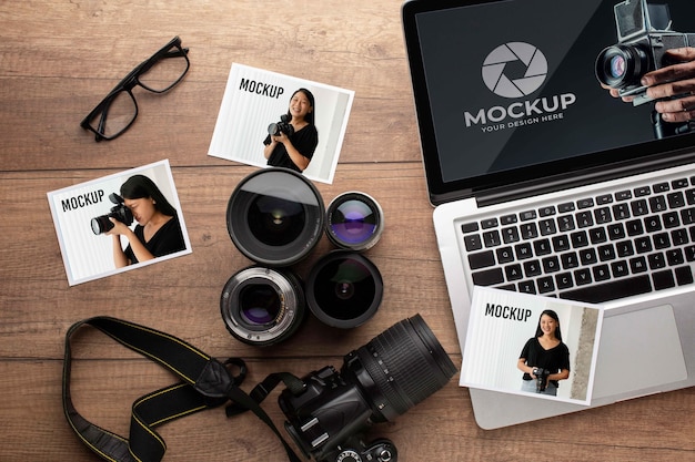 PSD flat lay of photographer wooden workspace with laptop