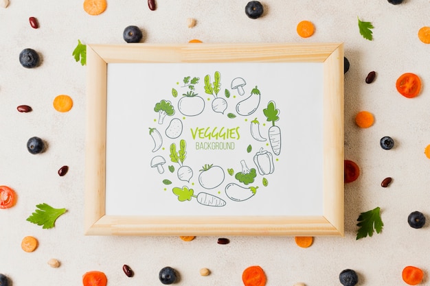 PSD flat lay vegetables assortment with frame mock-up