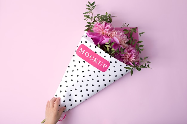 PSD flower packaging cone mock-up with beautiful flowers bouquet