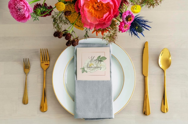 Flowers bouquet with  a card mockup on a white plate