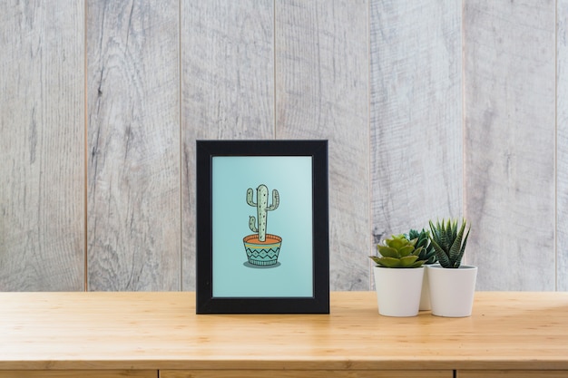 Frame mockup on table with plants