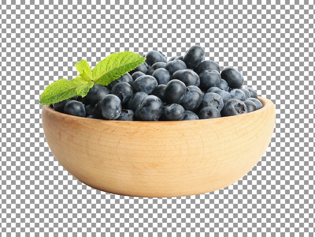 Fresh blueberries with a leaf in a wooden bowl isolated on transparent background