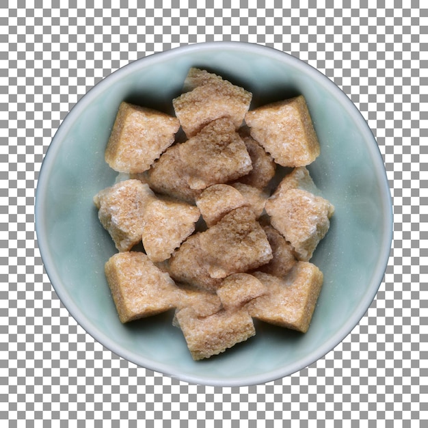 Fresh brown sugar cubes in a blue bowl with transparent background