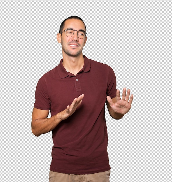 Friendly young man doing a gesture of keep calm