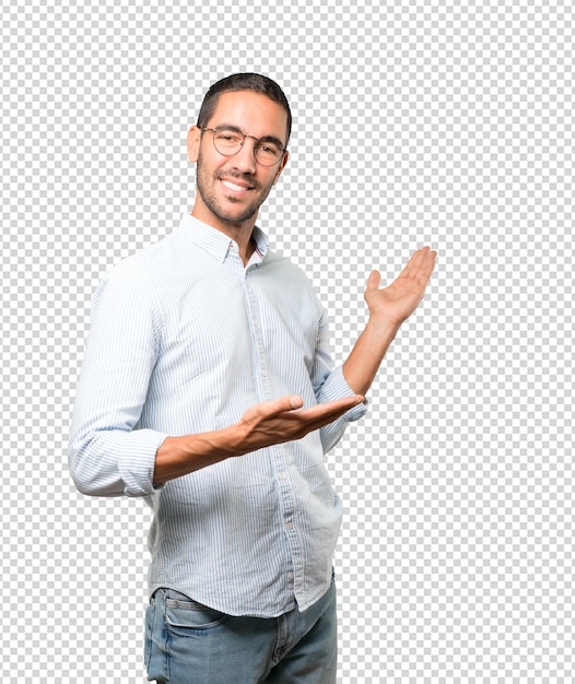 Friendly young man making a gesture of welcome